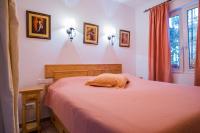 A bed or beds in a room at Casa Charlotte