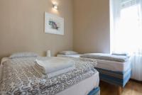 Łóżko lub łóżka w pokoju w obiekcie Apartments Downtown