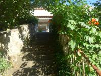 a stairway leading up to a house with plants at La Colline Bleue in Banne