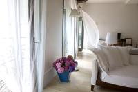 A bed or beds in a room at Milano Suites
