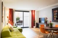 Televízia a/alebo spoločenská miestnosť v ubytovaní Cosmo Apartments Passeig de Gràcia