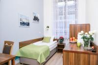 Postel nebo postele na pokoji v ubytování Apartamenty Bonerowska 5