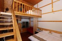 a bedroom with a bunk bed and a staircase at New Life Hot Spring Resort in Yuli