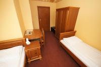 Łóżko lub łóżka w pokoju w obiekcie Hotel Vega