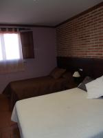 Posteľ alebo postele v izbe v ubytovaní Hotel Rural El Rocal