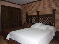 Posteľ alebo postele v izbe v ubytovaní Hotel Rural El Rocal
