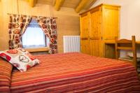 A bed or beds in a room at Hotel Restaurant La Barme