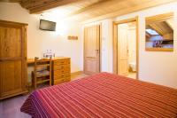A bed or beds in a room at Hotel Restaurant La Barme