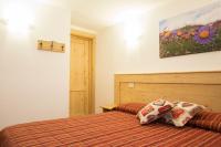 A bed or beds in a room at Hotel Restaurant La Barme