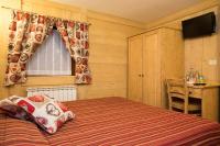 A bed or beds in a room at Hotel Restaurant La Barme