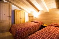 A bed or beds in a room at Hotel Restaurant La Barme