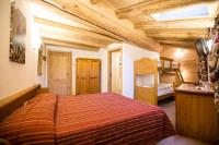 A bed or beds in a room at Hotel Restaurant La Barme