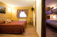 A bed or beds in a room at Hotel Restaurant La Barme