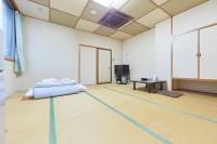 ホテルセレクトイン古川 にあるベッド