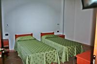 A bed or beds in a room at Case Vacanze Pietragrande