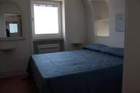 A bed or beds in a room at La Torre