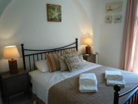 A bed or beds in a room at Anthos House