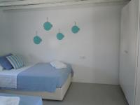 A bed or beds in a room at Anthos House