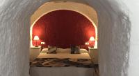 Postel nebo postele na pokoji v ubytování Casas Cueva y Cortijo La Tala en Guadix