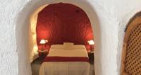 Postel nebo postele na pokoji v ubytování Casas Cueva y Cortijo La Tala en Guadix