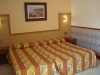 Posteľ alebo postele v izbe v ubytovaní Hotel Univers