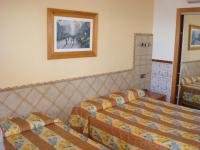 Posteľ alebo postele v izbe v ubytovaní Hotel Univers