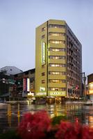 a large building on a city street at night at Gene Long Haiy Att Hotel in Chiayi City