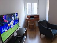 TV a/nebo společenská místnost v ubytování Apartamento Rialto
