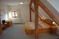 Postel nebo postele na pokoji v ubytování Hotel Růže