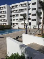 a view of the apartment building from the pool at Iken Park Agadir in Agadir