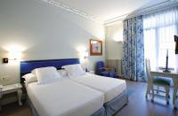 Łóżko lub łóżka w pokoju w obiekcie Hotel Niza