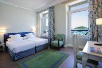 Łóżko lub łóżka w pokoju w obiekcie Hotel Niza
