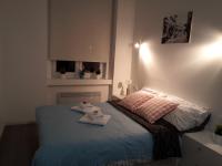 Posteľ alebo postele v izbe v ubytovaní Haustor Apartments