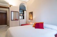A bed or beds in a room at Plinius