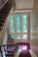 a staircase in a house with a large window at Hotel Anlage Heidelberg in Heidelberg