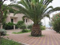 A garden outside Lakonia Bay Apartments