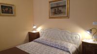 A bed or beds in a room at Al Pic de Corone