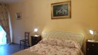 A bed or beds in a room at Al Pic de Corone