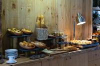 a buffet of bread and pastries on a table at Silverland Yen Hotel in Ho Chi Minh City