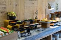 a buffet line with many different types of food at Silverland Yen Hotel in Ho Chi Minh City