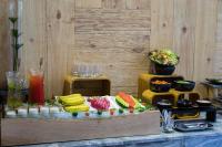 a buffet with sushi and other food on a table at Silverland Yen Hotel in Ho Chi Minh City