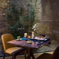 a table with a tray of food and candles on it at Silverland Yen Hotel in Ho Chi Minh City