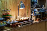 a buffet with different types of food on display at Silverland Yen Hotel in Ho Chi Minh City