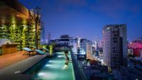 a person walking on the rooftop of a building at Silverland Yen Hotel in Ho Chi Minh City