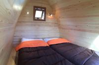 Postel nebo postele na pokoji v ubytování Bungalows - Càmping El Solsonès