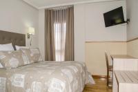Postel nebo postele na pokoji v ubytování Hotel Presa