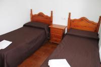 Postel nebo postele na pokoji v ubytování Hostal Montilla Sotogrande