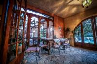 a dining room with a table and chairs at Castellu Rossu in Lucciana