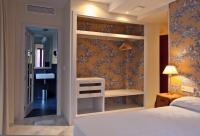 Posteľ alebo postele v izbe v ubytovaní Suites Murillo Alcázar