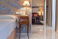 Posteľ alebo postele v izbe v ubytovaní Suites Murillo Alcázar